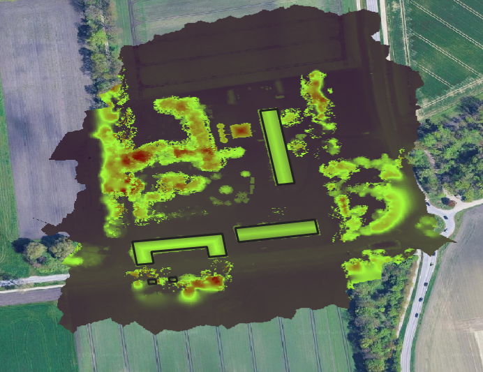 Solar exposure heat map draped over the site orthophoto, brighter areas marking higher modelled insolation on rooftops